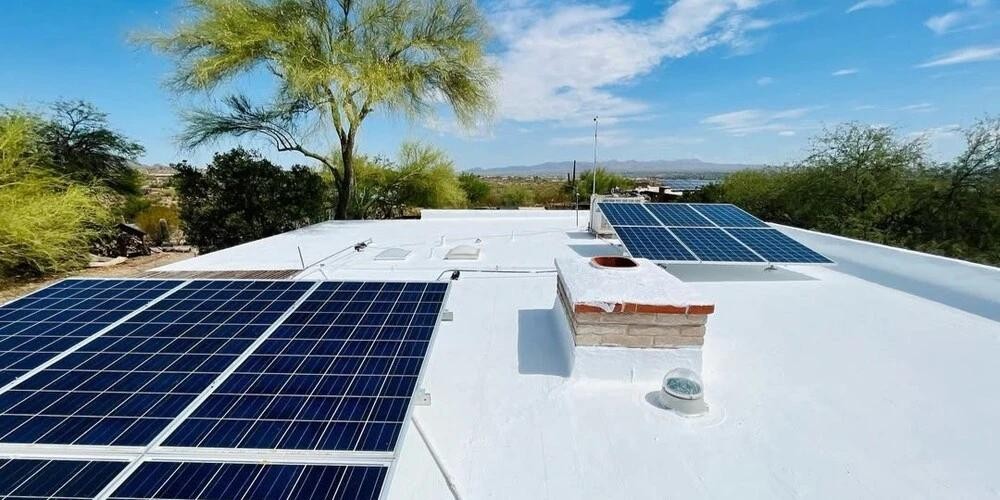 White residential flat roof with solar panels